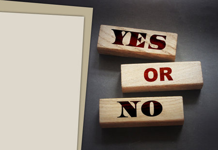 Words YES or No on wooden blocks. Choice business, personal or education concept.