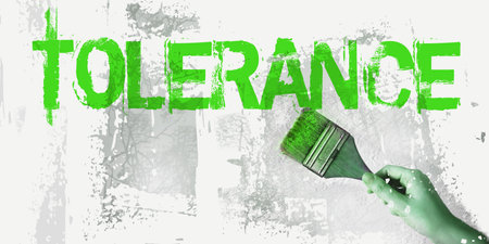 Tolerance word in red, and paintbrush on white gray grunge background. Social relationship business and career concept.の写真素材
