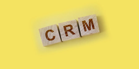 CRM Customer Relationship Marketing written on a wooden cubes. Business concept.の写真素材