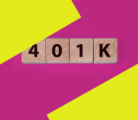 Retirement plan 401k, investment for senior concept, cube wooden block with alphabet combine the word abbreviation 401k on greenの写真素材