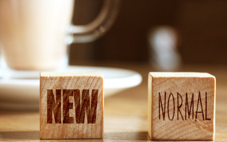 Wooden block cubes for new normal wording. The world is changing to balance it into new normal...