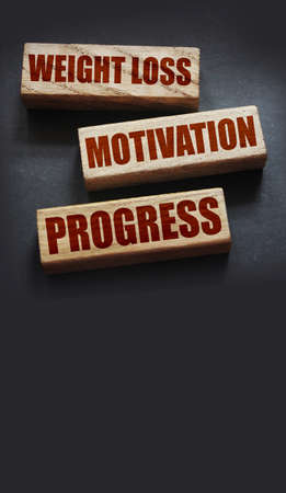 Weight loss motivation progress words on wooden blocks with copyspace. Successful diet healthy food weightloss conceptの写真素材