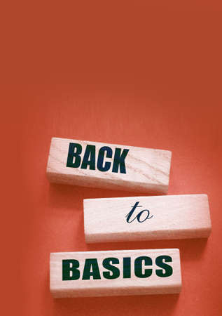 The words back to basics made of letters on wooden blocks. back to basics - fundamental principles...