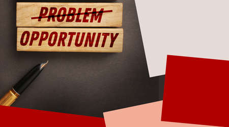 Problem crossed out and opportunity on wooden blocks. Business startup concept.の写真素材