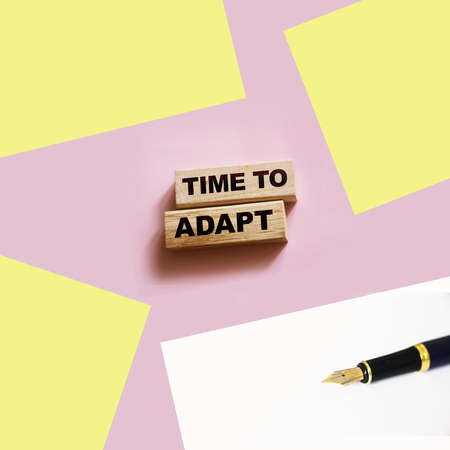 Time to adapt words on Wooden blocks. new normal word concept. Business crisis conceptの写真素材