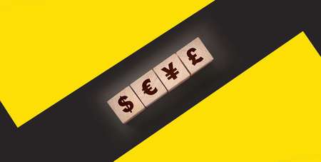 Dillar, euro, yen and pound on building blocks. wooden cubes with different money signs, Cuurency,...