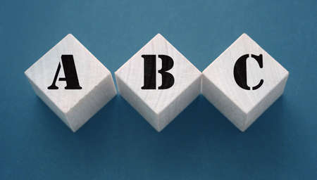 ABC Three wooden cubes with letters. Back to basics elementary school concept.