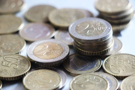 Euro coins on a wooden background. Business and finance concept.の写真素材