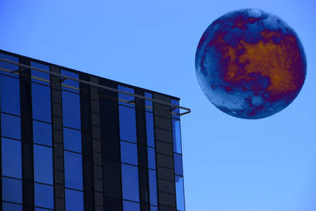 City landscape under big moon at night. Fantastic urban cityscape.の写真素材