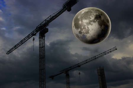 City landscape under big moon at night. Fantastic urban cityscape.の写真素材