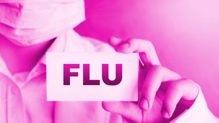 Doctor holding a card with text Flu, medical concept.の写真素材