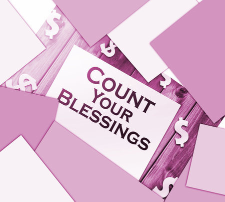 The phrase Count Your Blessings typed on a piece of paper and paper dollar signs around. Career conceptの写真素材