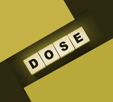 Wooden blocks with the word Dose. Medical concept.