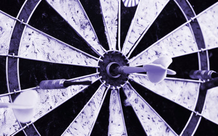 Darts target closeup. Success hitting target aim goal achievement concept.の写真素材