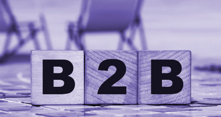 Business to Business concept. B2B letters on wooden cubes. Sunny beach and ocean background. Online business trading concept.の写真素材
