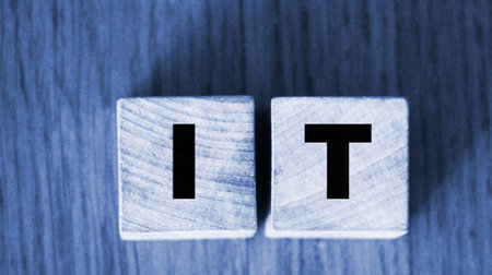IT Letters on wooden cubes. Information technologies business concept.の写真素材