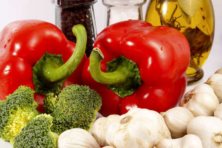 Colored vegetables - red pepper, green broccoli and white garlicの写真素材
