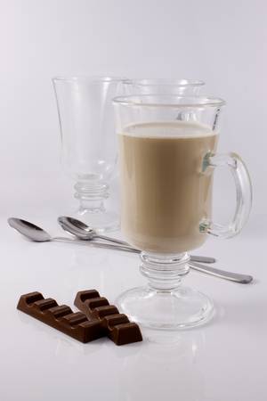 Coffee frappe in a tall glass on a black backgroundの写真素材