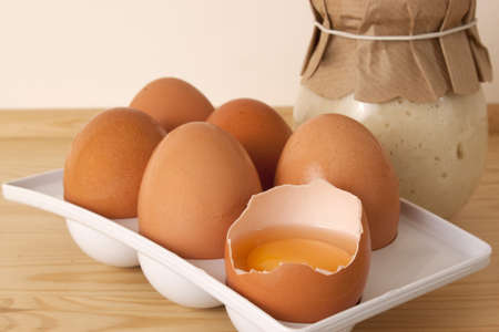Raw eggs in shell and horseradish in a jarの写真素材