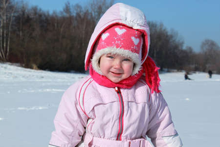 Girl playing in the snowの写真素材