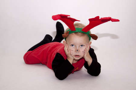 Small girl dressed as reindeerの写真素材