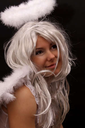 Sexy angel women on a black background の写真素材
