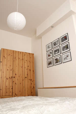 Modern bedroom with pine wardrobeの写真素材