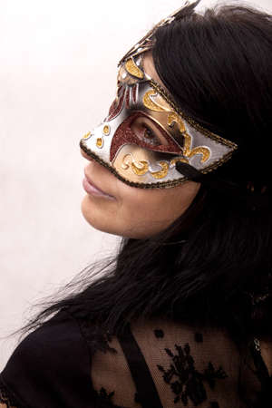Sexy woman in venetian mask on a white backgroundの写真素材