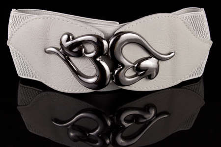 Gray wide belt on the black backgroundの写真素材
