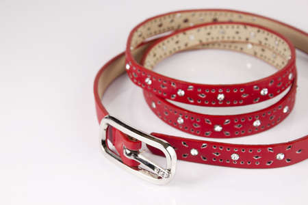 Red womanly belt on the white backgroundの写真素材
