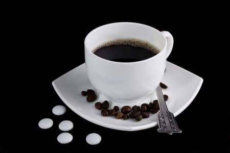 Cup of tasty coffee and spoonの写真素材