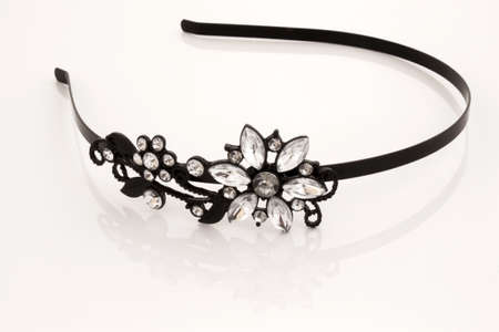 Beautiful black hair band with crystal flower on a white backgroundの写真素材