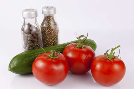 Tomatoes, cucumber and condimentsの写真素材