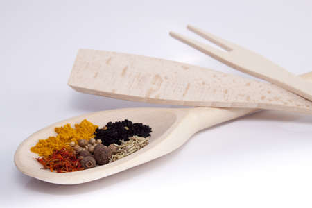 Colorful relishes on wooden spoonの写真素材