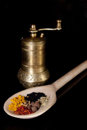 Coloured condiments on a black backgroundの写真素材