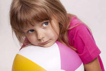 A pretty girl with inflatable ballの写真素材