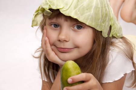 Child with cucumberの写真素材