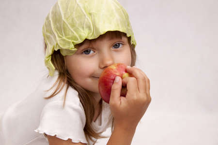 Pretty girl with red appleの写真素材