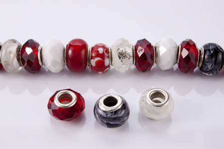 Red and white beads on a white backgroundの写真素材