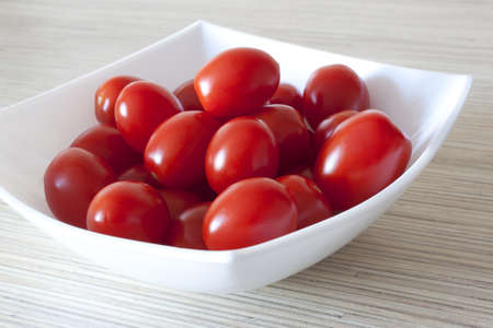 Small tomatoes in a white bowlの写真素材
