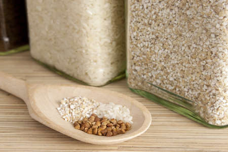 Grains on a wooden spoonの写真素材