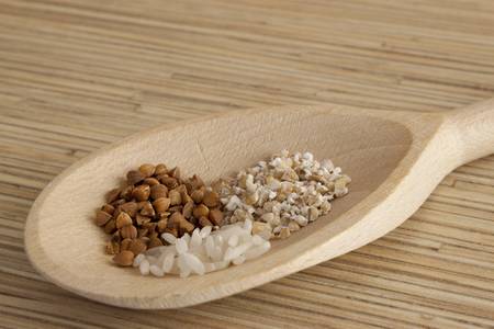 Grains on a wooden spoonの写真素材