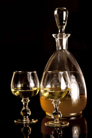 Old carafe with yellow vodkaの写真素材
