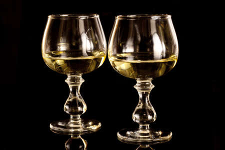 Two glasses with honey vodkaの写真素材