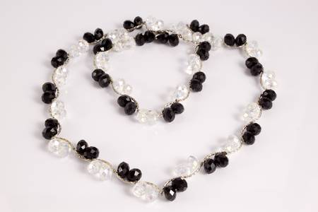 Black-and-white necklace on a white backgroundの写真素材