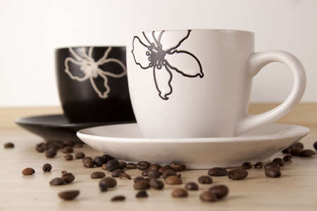 Two cups of coffee with coffee beansの写真素材