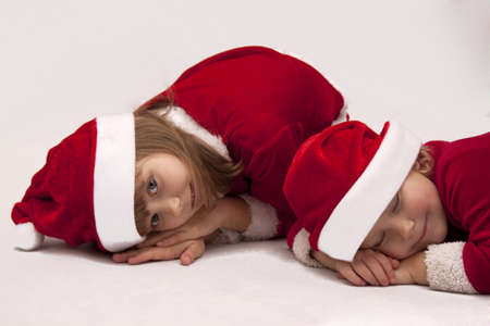 Sisters dressed as santa clausの写真素材
