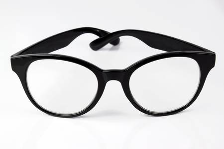 Black glasses on a white backgroundの写真素材