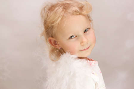 Little girl as sweet angelの写真素材