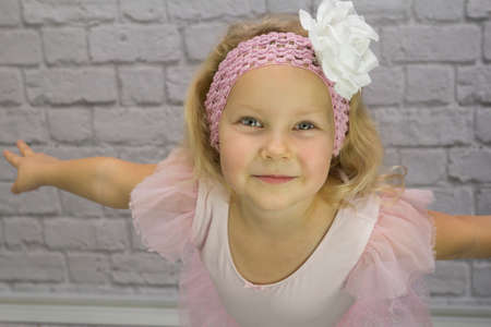 Lovely girl as a ballerina in a pink dressの写真素材